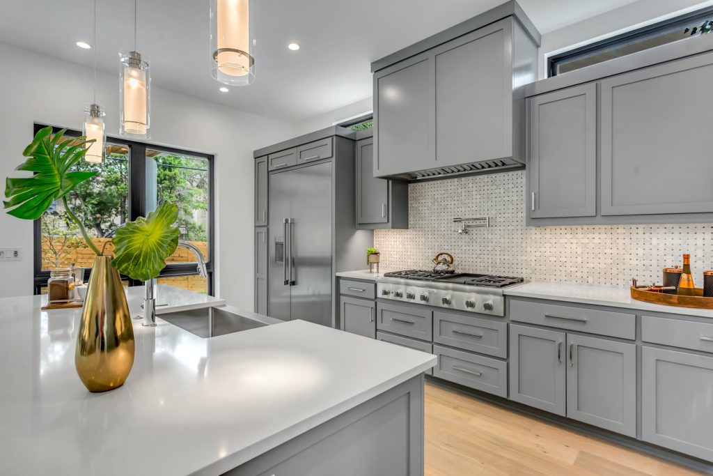 a kitchen with white cabinets