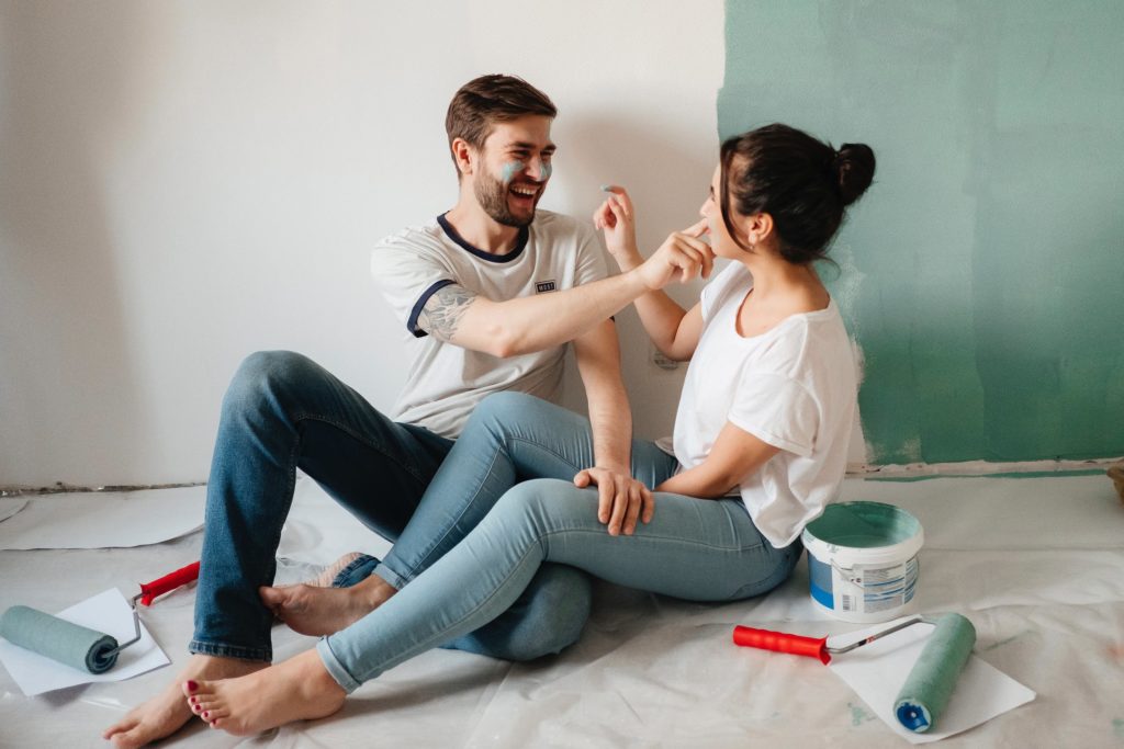 a man and woman sitting on the floor