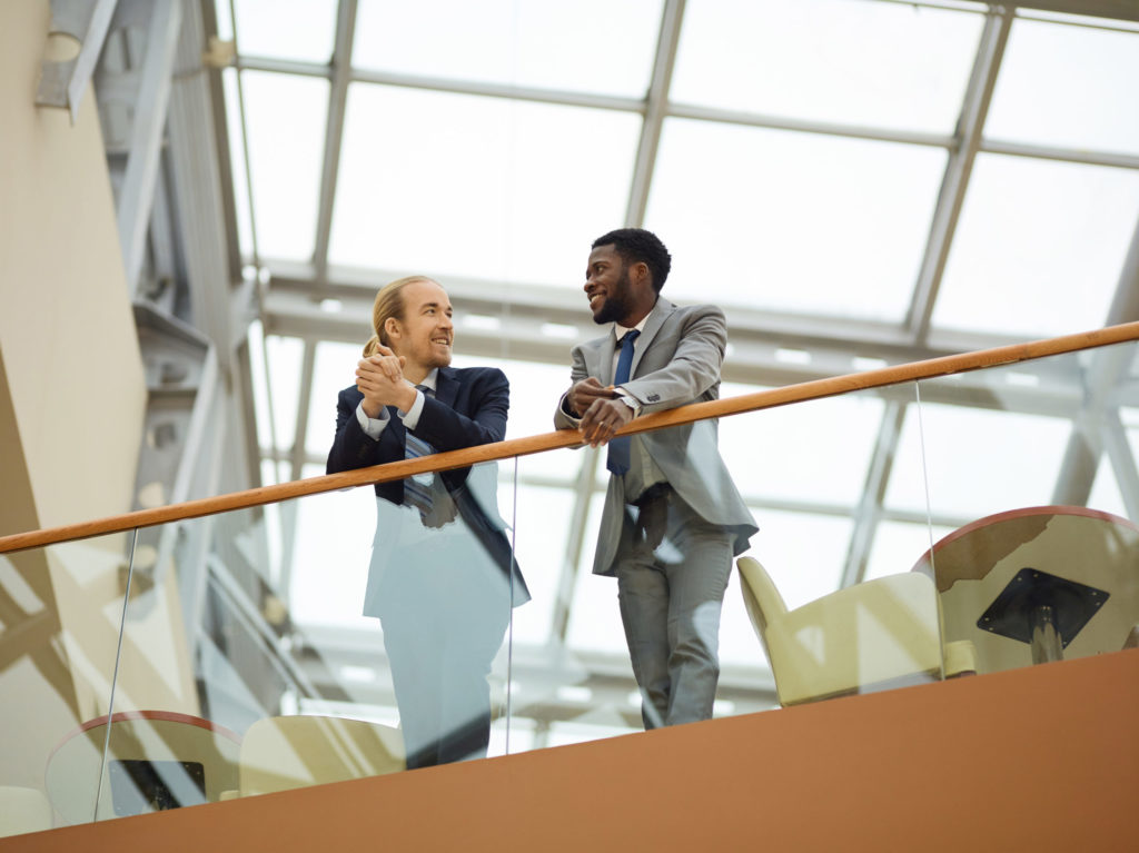 a man and woman standing on a staircase