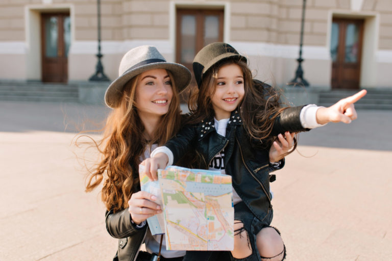 a couple of women holding books