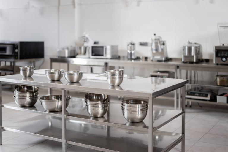 a kitchen with several stainless steel appliances